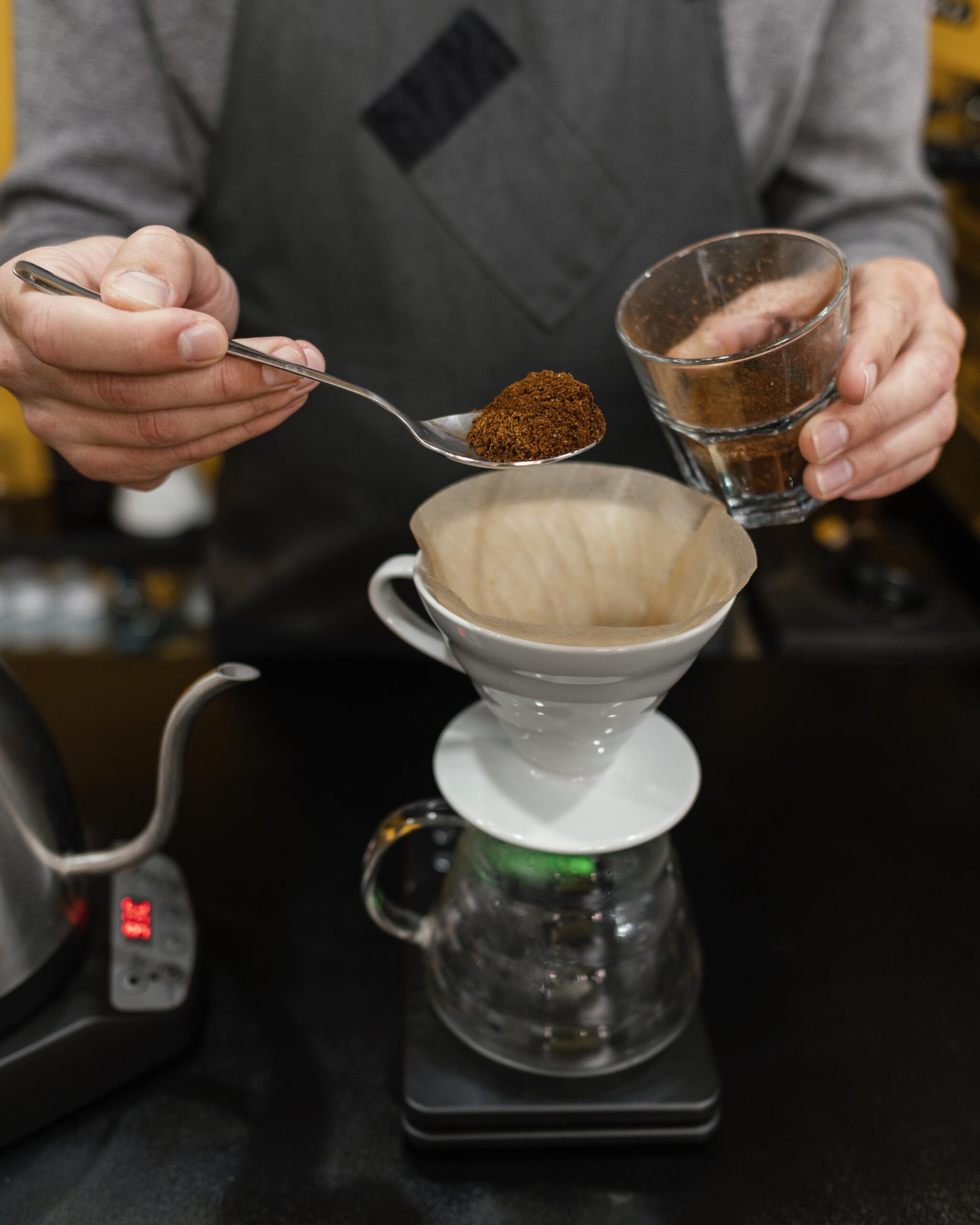 male-barista-putting-coffee-filter